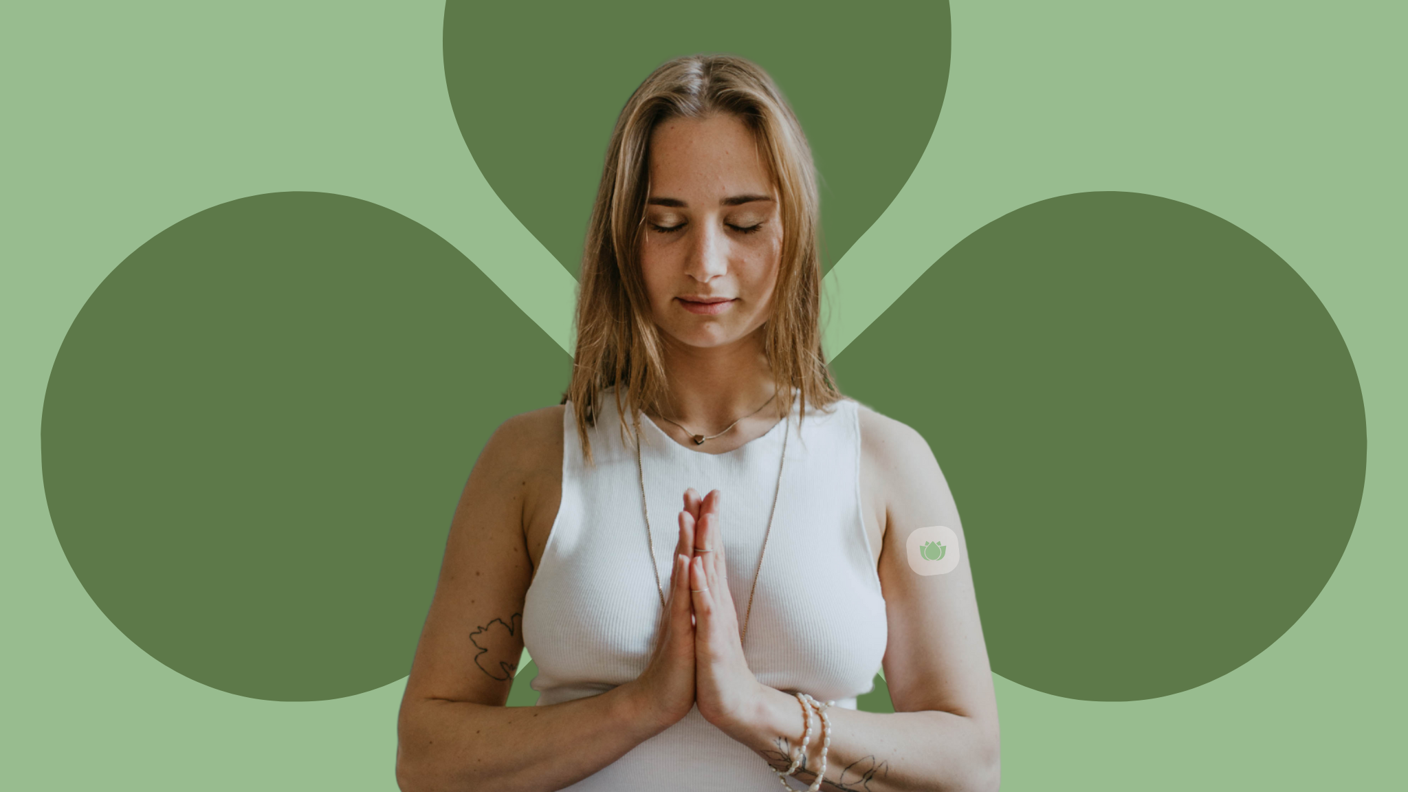 Woman meditating with hands clasped, head bowed, wearing The Big Chill™ Calm Patch infused with Ashwagandha.