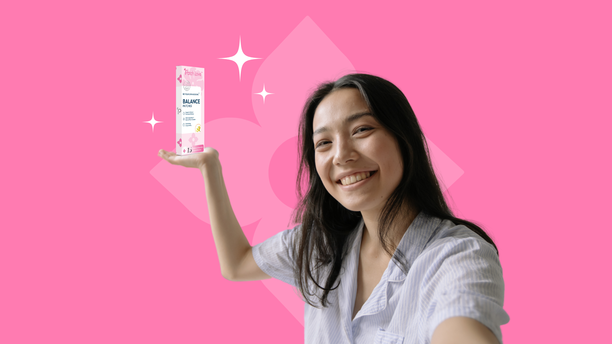 young asian woman smiling holding high a packet of Balance patches by patch love called be your own heroine for pms 